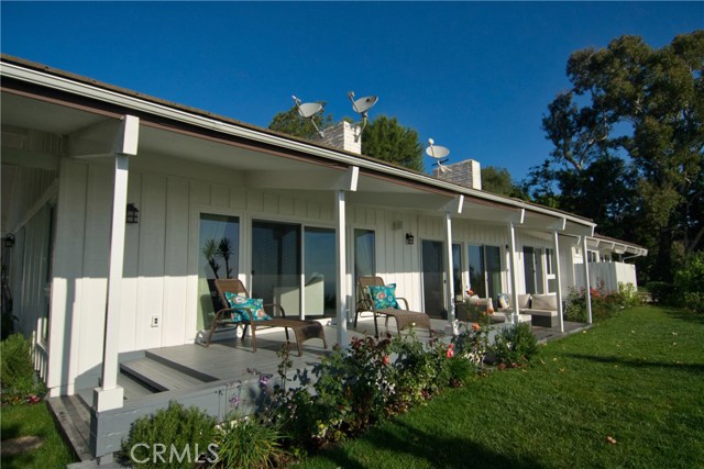 Beautiful back porch merges the indoors and outdoors - sliding glass doors in master suite, living room and family room bring in great natural light.