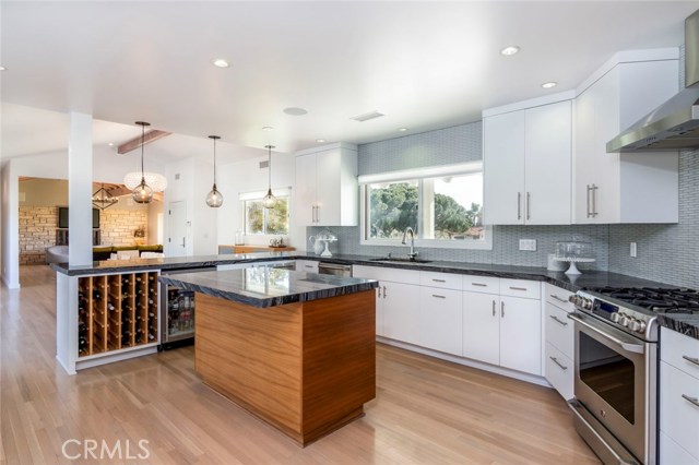 The open space from the kitchen to the dining room and views out onto the backyard pool and patios - this is the reason why the term 