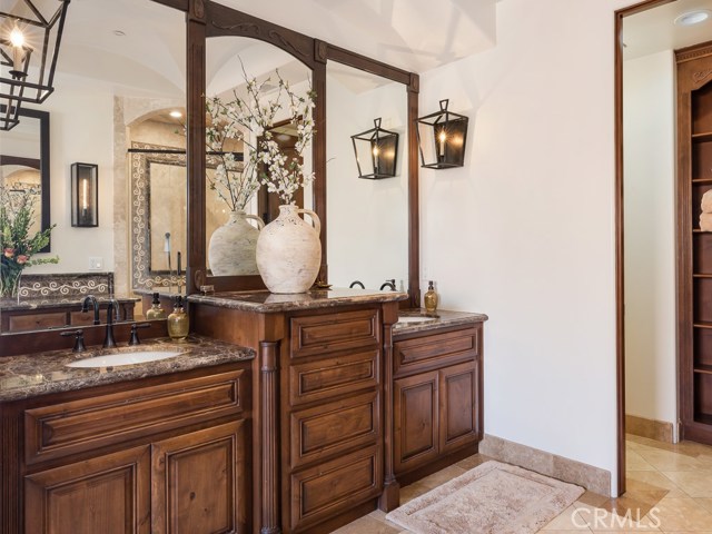 Dual sinks with lots of storage and custom lighting.