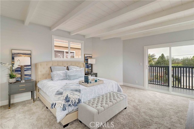 Upstairs master 14.5' x 16' with balcony and walk-in closet.