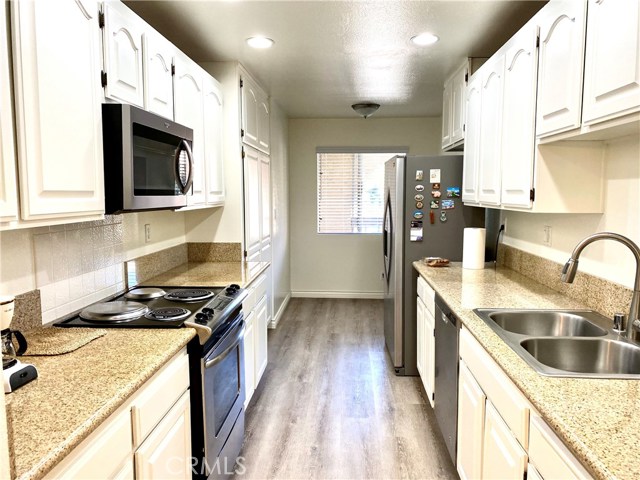 remodeled kitchen with granite counters, new SPC floor