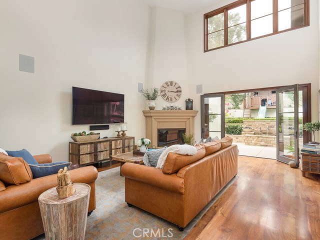 Massive family room with lots of windows. The large french doors bring the outside in.