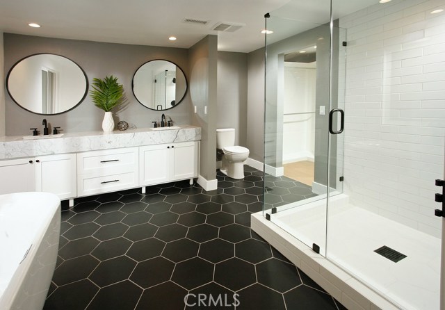 Master Bathroom: Ocean and Catalina Views-New expanded/enlarged-Freshly painted-New exhaust fans-New air vents-New dual pane windows-New recessed lights-New cabinets with shaker doors-Accent Wall-New Matte Black Mayfair round mirror-New Statuarietto marble counter tops-New Matte Black sink faucet and trim-New Freestanding soaking bathtub-New Matte Black floor mount faucet-New White ceramic tile shower-New 3/8 thick frameless shower glass with matte black hardware-New low flow Toto commodes-New Decora outle