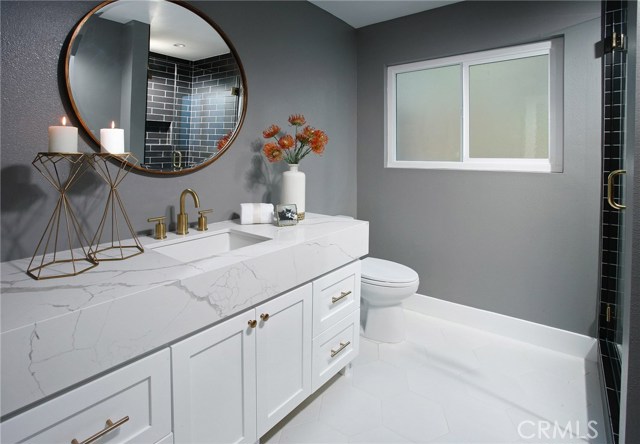 Downstairs Bathroom: Freshly painted-New recessed lights-New exhaust fans-New air vents-New cabinets with shaker doors-New Gold Mayfair round mirror-New Calacatta Laza quartz counter tops-New Brushed Gold faucet and trim-New low flow Toto commodes-New 3/8 thick frameless shower glass with polished brass hardware-Black Matte ceramic tile shower-New Decora outlets and switches-Opal white hexagonal porcelain tile floors.