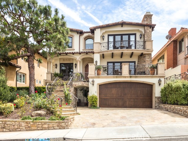 Front view of home with three terraces that have a city view.