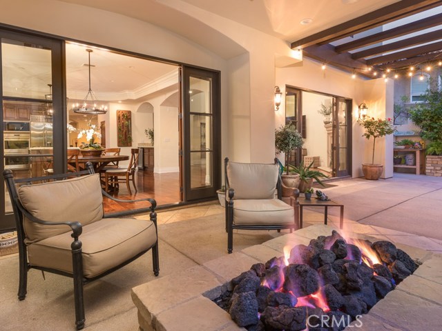 Twilight fire pit with view of the kitchen