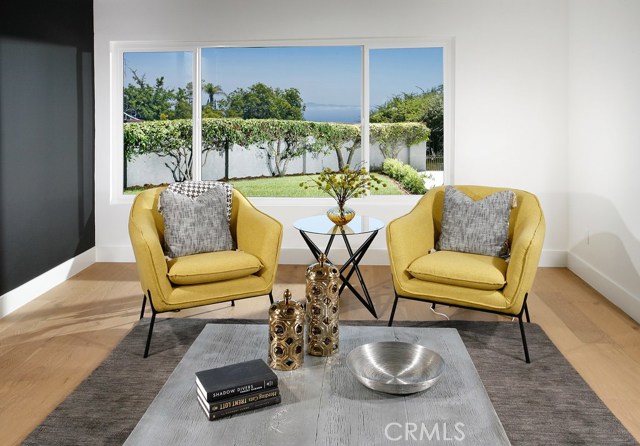 Living Room: Ocean and Catalina Views-New dual pane windows-Freshly painted-Black Accent Wall-New air vents-New Decora outlets and switches-New 6 inch base boards-New Copa Coast hardwood floor.