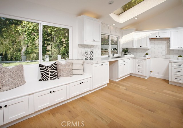 Kitchen: Ocean Views-Freshly painted-New recessed lights-Kraft Maid cabinets with shaker doors-New Calacatta Translux quartz counter tops-New Walker Zanger Plaster Montclair Flat and Deco backsplash-New Matte Black Mirabelle kitchen pull down faucet-New Kohler undermount kitchen sink-New garbage disposal-New Decora outlets and switches-New Copa Coast hardwood floor.