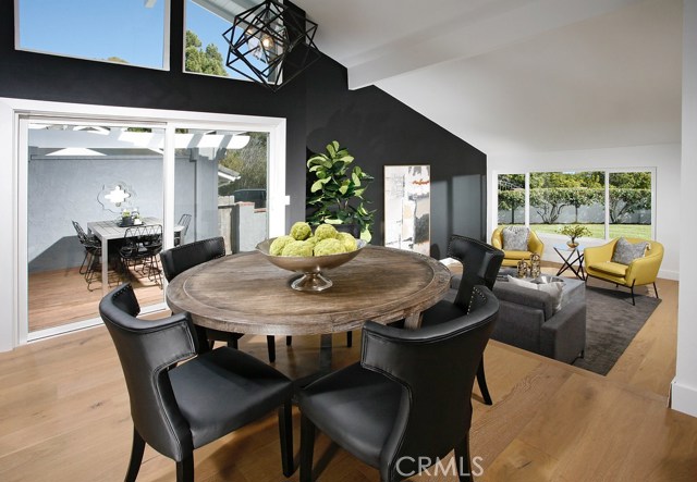 Dining room: Ocean View-Freshly painted-Black Accent Wall-New dual pane windows-Matte Black Kelly Wearstler Cubist Small Chandelier-New Decora outlets and switches-New 6 inch base boards-New Copa Coast hardwood floor.