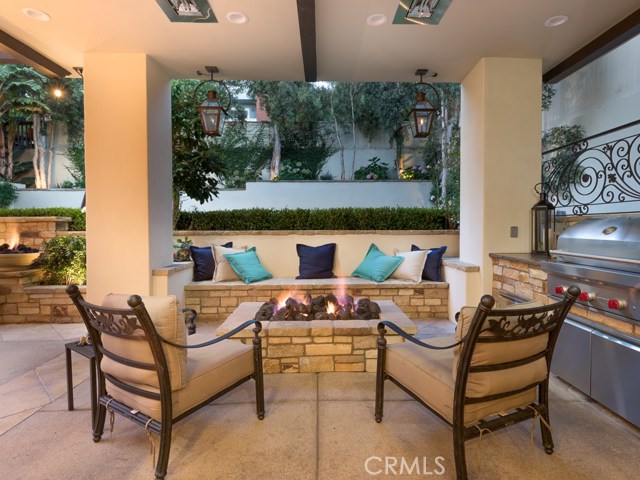 Fire Pit, Outdoor Kitchen and Seating Area.