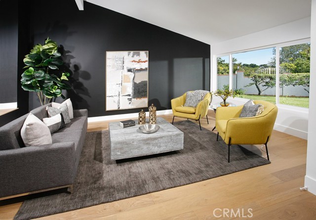 Living Room: Ocean and Catalina Views-New dual pane windows-Freshly painted-Black Accent Wall-New air vents-New Decora outlets and switches-New 6 inch base boards-New Copa Coast hardwood floor.