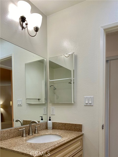 hallway full bath with skylight