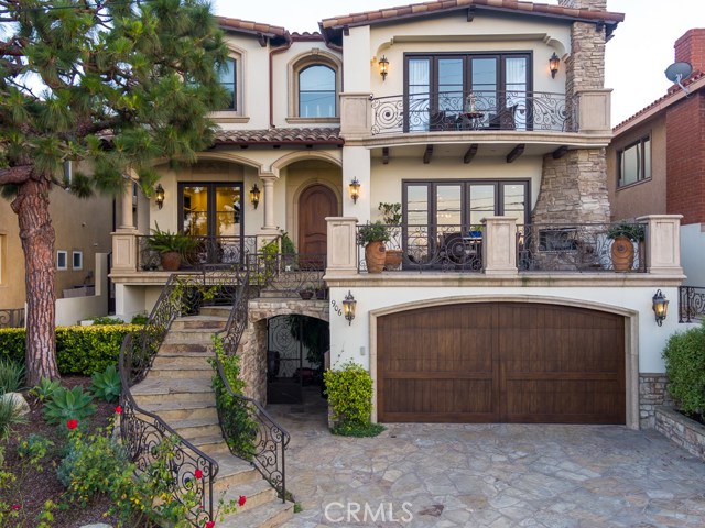 Front view with custom wrought iron and stone.