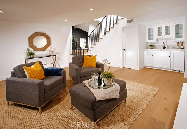 Family Room: -New recessed lights-New air vents-Kraft Maid cabinets with shaker doors-New Calacatta Translux quartz counter tops-New Matte Black Mirabelle bar faucet-New Kohler undermount bar sink-New Decora outlets and switches-New 6 inch base boards-New Copa Coast hardwood floor.