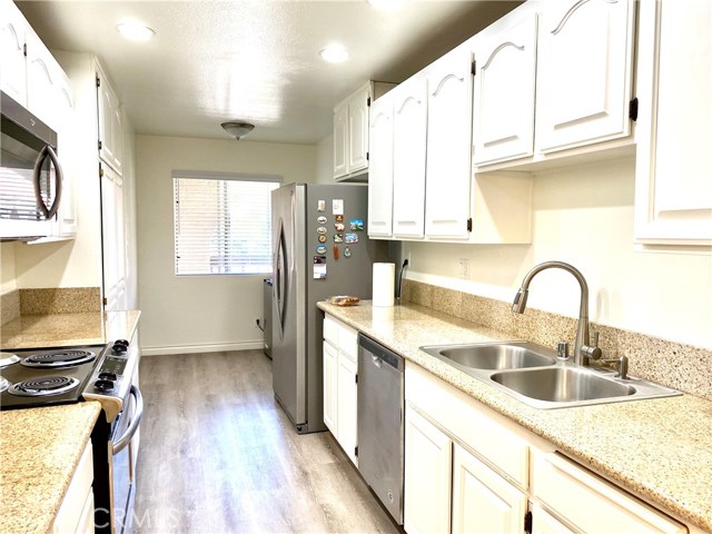 white cabinets,  separate dining area