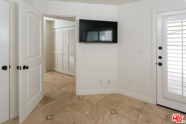 Office /den wi private entrance, walk-in closet, flatscreen TV & travertine floors (st floor).