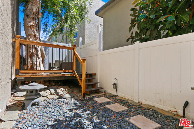 Back yard area accessible through kitchen