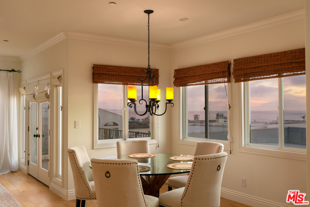 Panoramic, ocean views & open floor plan from kitchen, at dusk (rd floor).