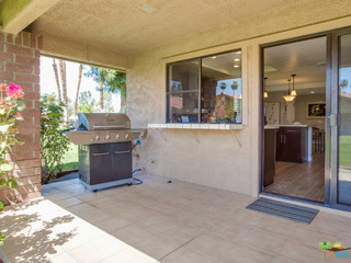 Covered patio with gas hookup which connects to kitchen