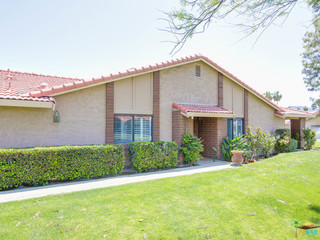 End unit surrounded by green scape