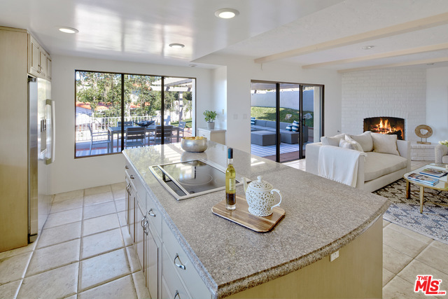 Kitchen opens up to the perfect family room and outdoor patio and exterior dining area