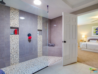 large master shower with glass and rain shower head