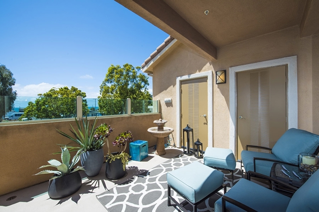 This large balcony off of the living room and kitchen is lovely place to enjoy your morning coffee.