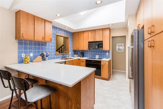 Quartz countertop in kitchen nook installed in 2018; Corian countertops in kitchen; Bosch dishwasher installed in 2016; 3-year old KitcheAId refrigerator included upon request