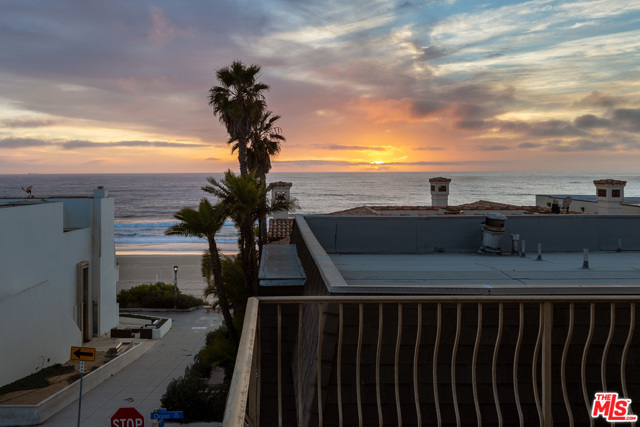 Panoramic, ocean views from living room balcony, at dusk (rd floor).