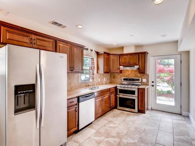 Upgraded kitchen with stainless steel appliances.