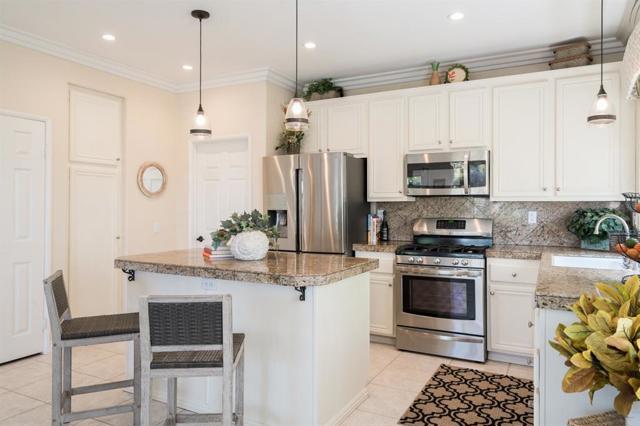 Kitchen features plenty of cabinets, 2 pantries and a coat closet