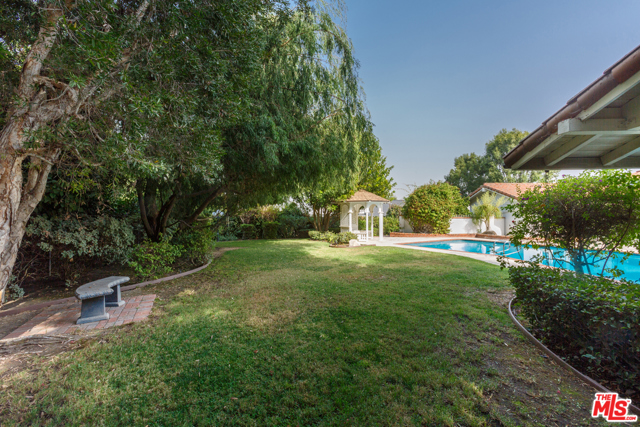 Gray yard, gazebo, pool