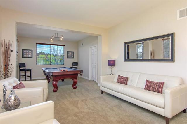 You will love this spacious living room and dining room for entertaining. Take a look at the view of the valley/canyon from the dining room window!