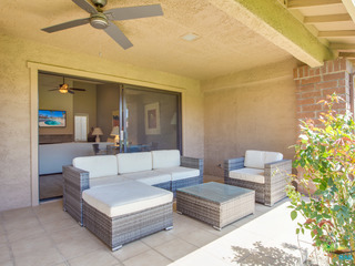 Sitting area in patio and ceiling fan