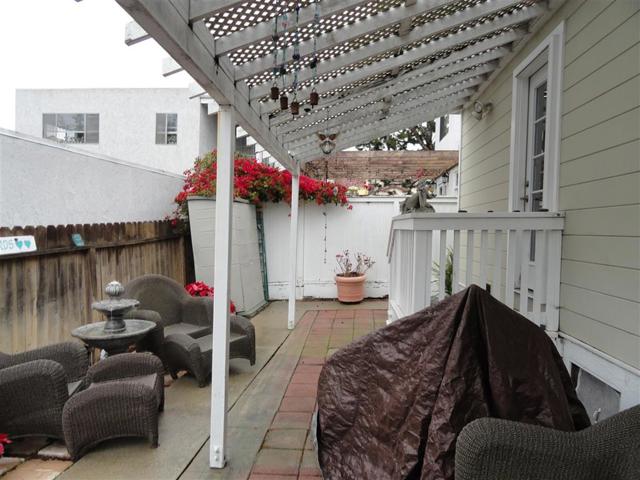 Back patio looking east. Storage shed conveys.