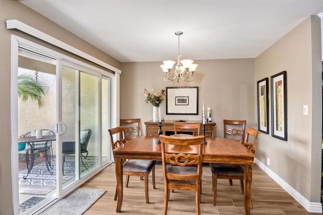 Dining room is steps away from the kitchen and offers easy access through your new dual pane sliding glass doors to a wonderful patio/garden area.