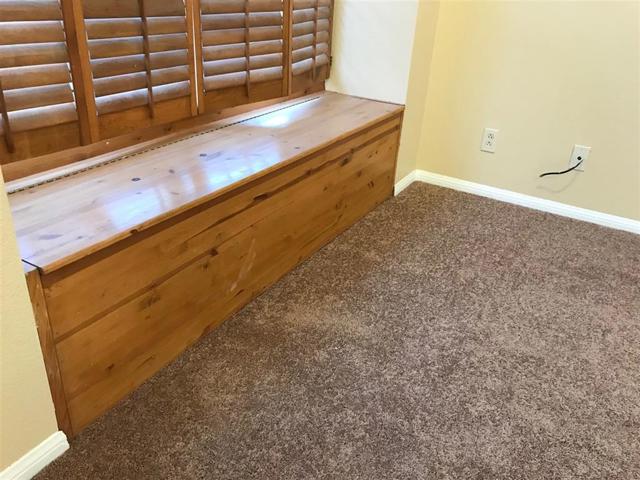 Living room storage area that can eaily be used as a bench for family and friend gatherings.  Just quickly clean all those kiddie toys up before enteraining.