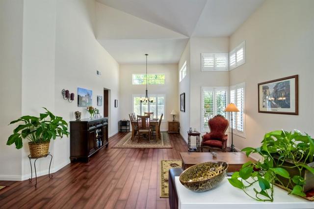 As you enter the home, the living room & dining room are straight ahead- the hallway & stairs to your left.....kitchen entrance is left of the dining room.