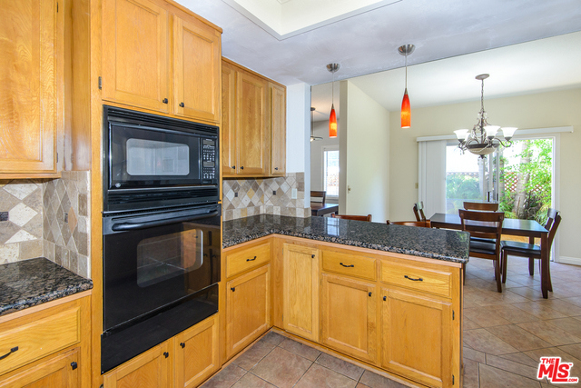 Kitchen Opens to the Kitchen Eating Area and Backy