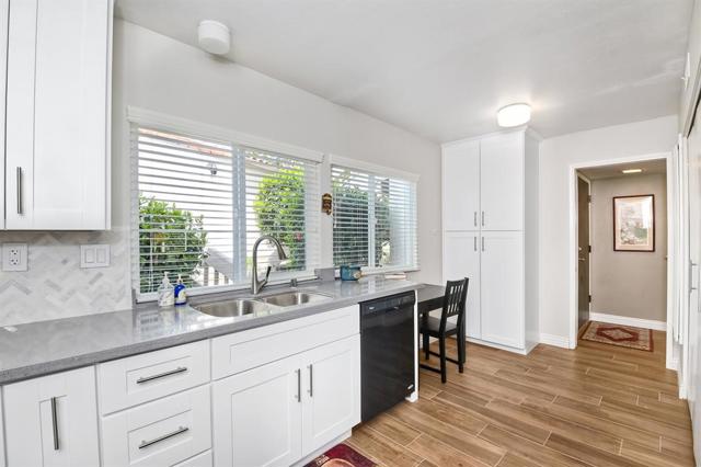 Yet another angle to this well designed kitchen - storage pantry at the end is ideal for storing all of your entertaining accoutremonts!