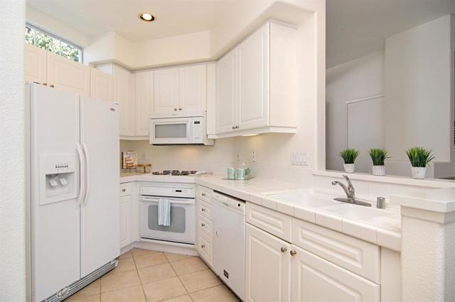 You'll enjoy all the Cabinet space in this Kitchen,  the Recessed Lighting AND Under-Cabinet Lights as well!