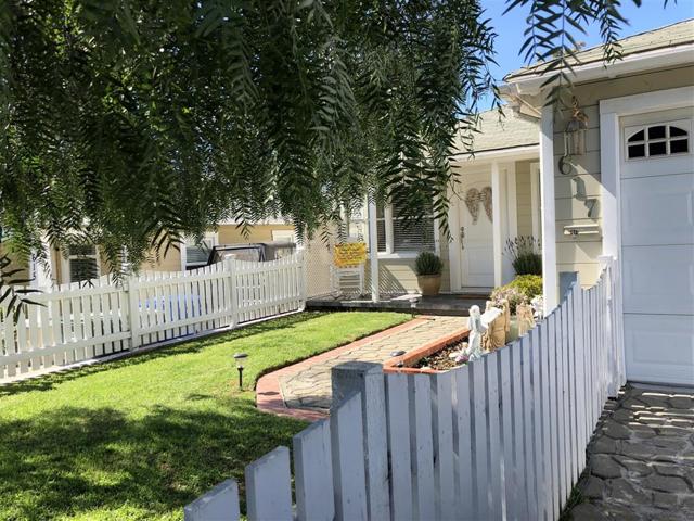 Beautiful fenced-in front yard.