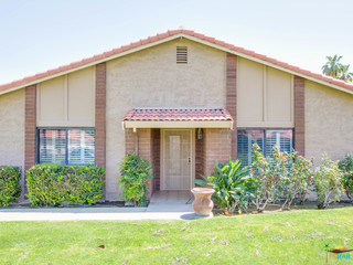 Entry of unit with guest parking near