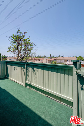 large private outdoor patio overlooking bike/ walk path