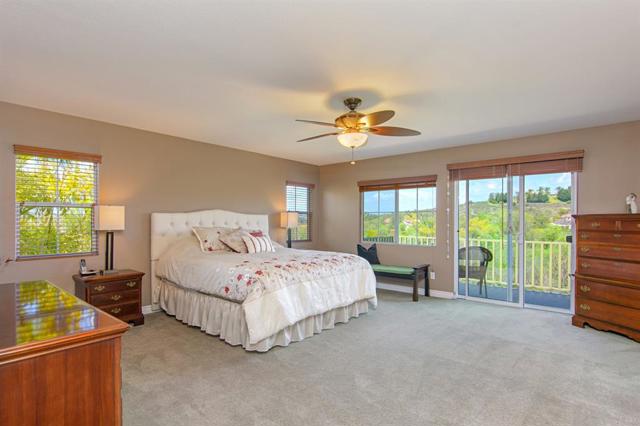 The master bedroom is large and welcoming!  You must walk out on the deck and look at the View.