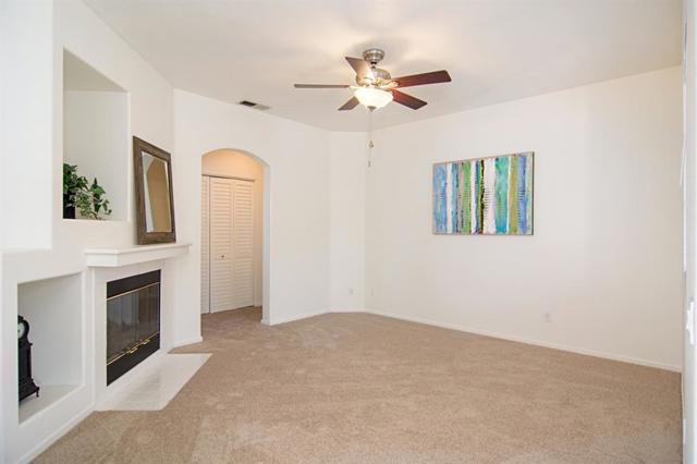 BRAND NEW Carpet & FRESH Paint finish off the Living Area beautifully! Designer Ceiling Fan/Light adds a nice touch to the High Ceiling!