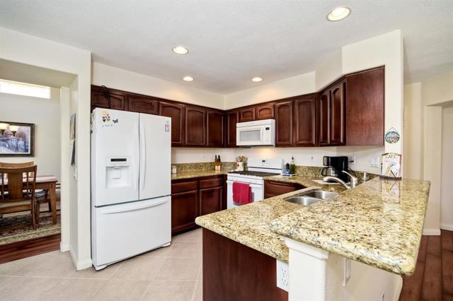 Granite counters and newer appliances. Cabinets refinished.