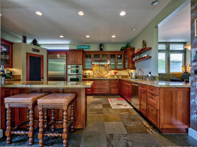 Sit at the counter/bar & eat or keep the cook company. Lots of room in this kitchen!