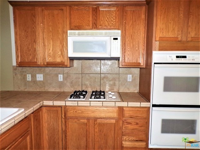 Solid Oak Cabinetry Is Warm And Roomy