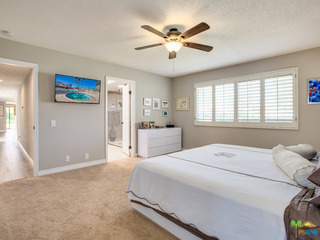 TV in master bedroom and plantation shutters